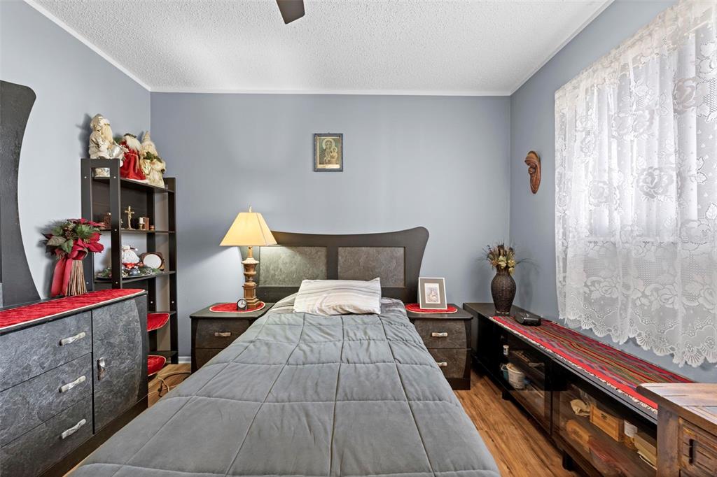 4307 Goldcoast Avenue Spring Hill, FL 34609 - Photo 33 of 53 a bed room with a bed and a television