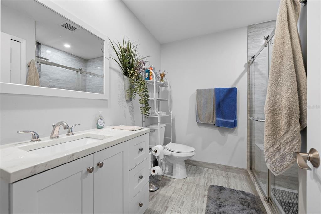 4307 Goldcoast Avenue Spring Hill, FL 34609 - Photo 34 of 53 a bathroom with a sink toilet and shower