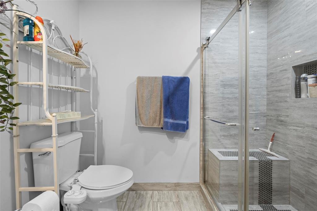 4307 Goldcoast Avenue Spring Hill, FL 34609 - Photo 35 of 53 a bathroom with a toilet and a shower