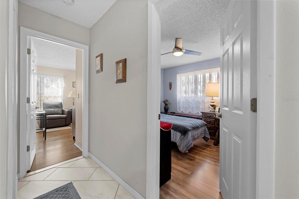 4307 Goldcoast Avenue Spring Hill, FL 34609 - Photo 36 of 53 a view of a hallway with a livingroom and a couch
