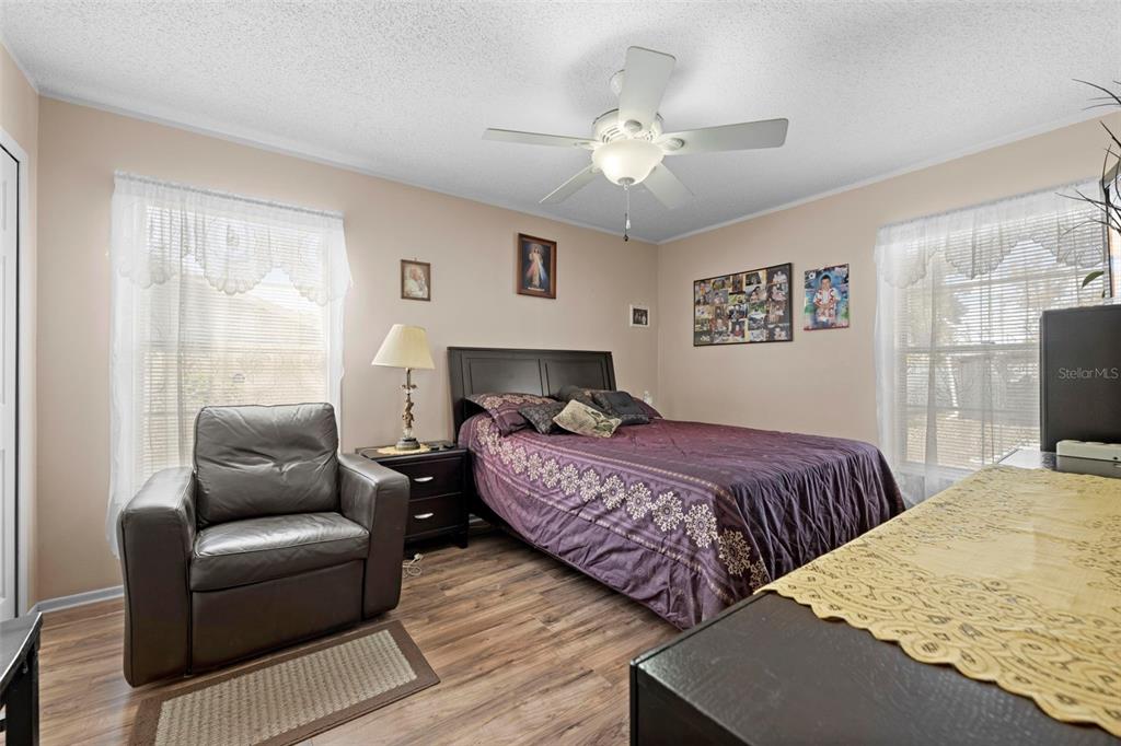 4307 Goldcoast Avenue Spring Hill, FL 34609 - Photo 37 of 53 a bedroom with bed and wooden floor