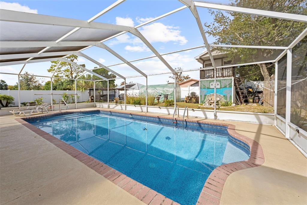 4307 Goldcoast Avenue Spring Hill, FL 34609 - Photo 42 of 53 a view of a living room and bathroom