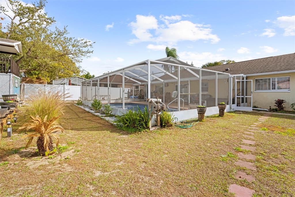 4307 Goldcoast Avenue Spring Hill, FL 34609 - Photo 51 of 53 a view of a house with backyard and sitting area