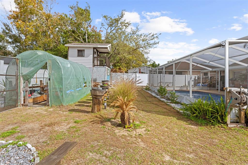 4307 Goldcoast Avenue Spring Hill, FL 34609 - Photo 52 of 53 a view of a house with backyard and sitting area