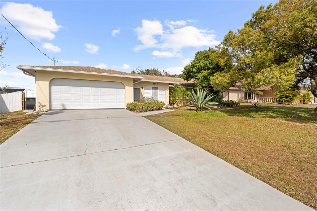 4307 Goldcoast Avenue Spring Hill, FL 34609 - Photo 9 of 53 a view of swimming pool with an outdoor space and seating area