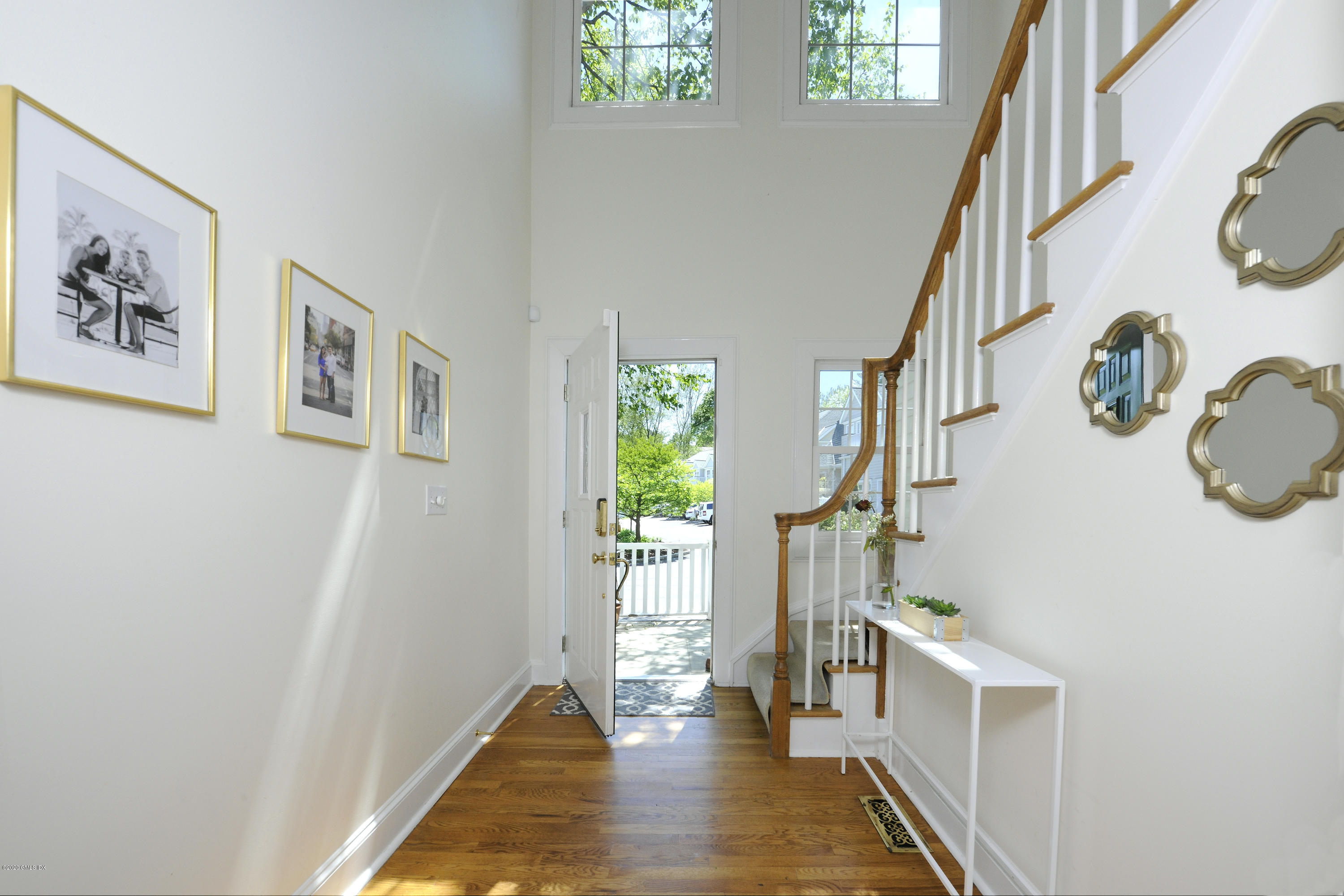 48 Spring Street, Unit 10 Greenwich, CT 06830 - Photo 2 of 11 a view of an entryway with wooden floor