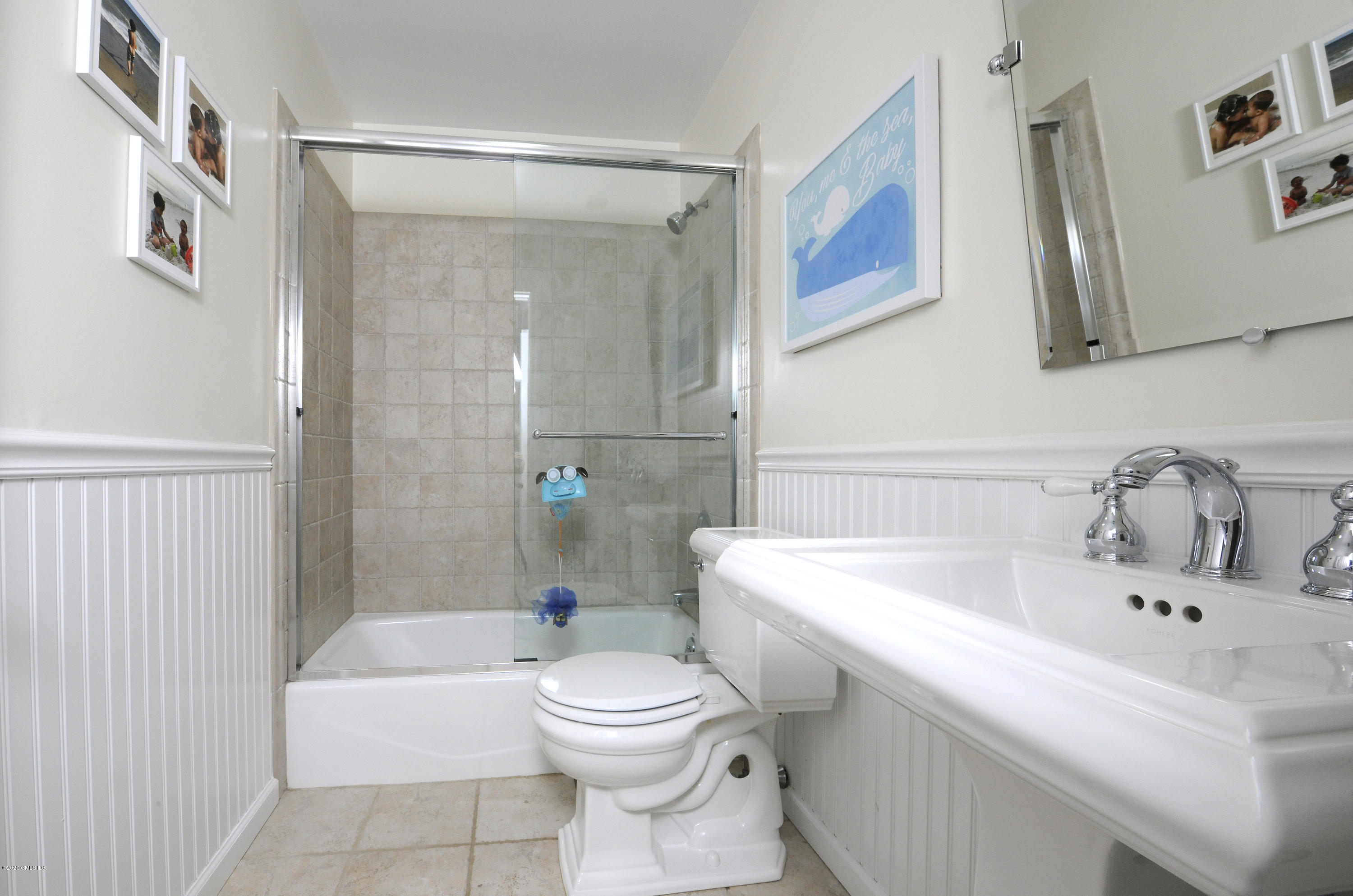 48 Spring Street, Unit 10 Greenwich, CT 06830 - Photo 10 of 11 a bathroom with a sink a toilet and shower