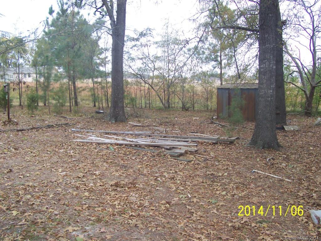 5416 Laney Rogers Road Monroe, NC 28112 - Photo 4 of 24 a view of a yard with trees