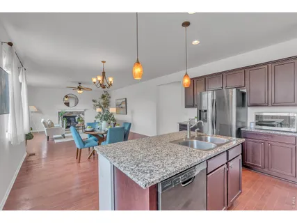 a kitchen with a table and chairs in it