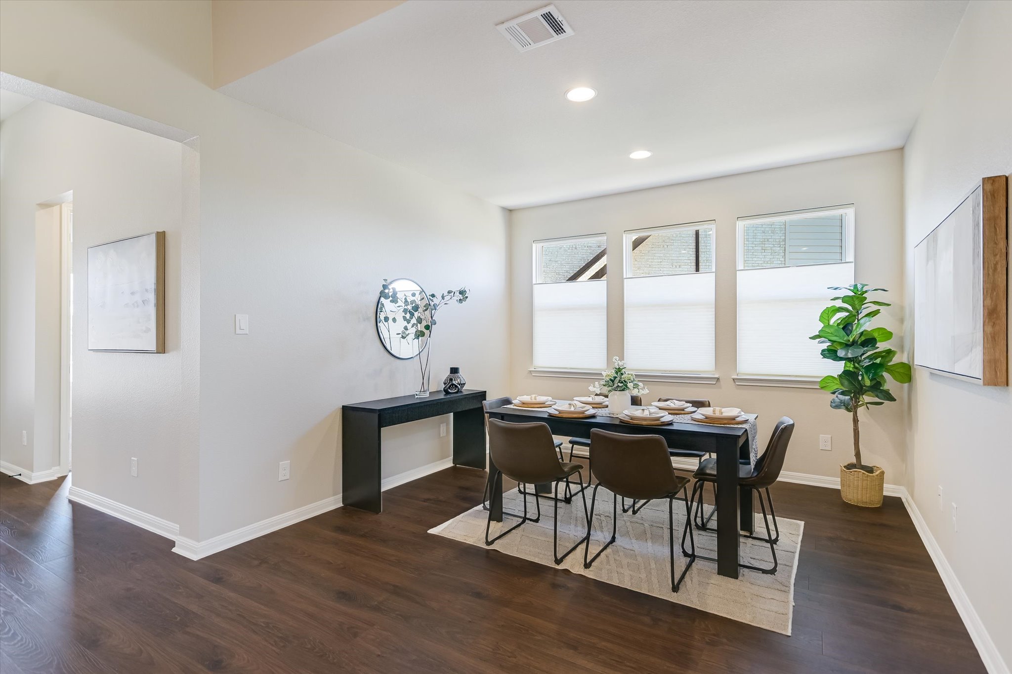 108 Trans Pecos Court Georgetown, TX 78628 - Photo 12 of 32 a view of a dining room with furniture window and wooden floor