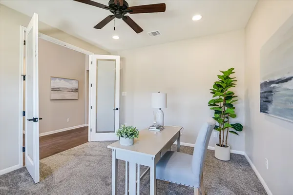 a view of a workspace with furniture