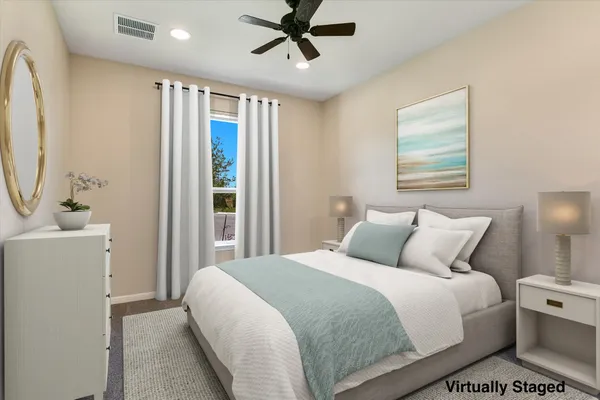 a bedroom with a large bed and a window