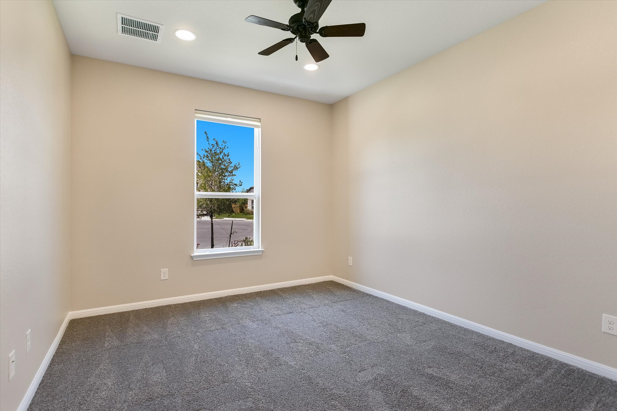 108 Trans Pecos Court Georgetown, TX 78628 - Photo 16 of 32 an empty room with windows and fan