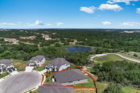 an aerial view of a house with a garden
