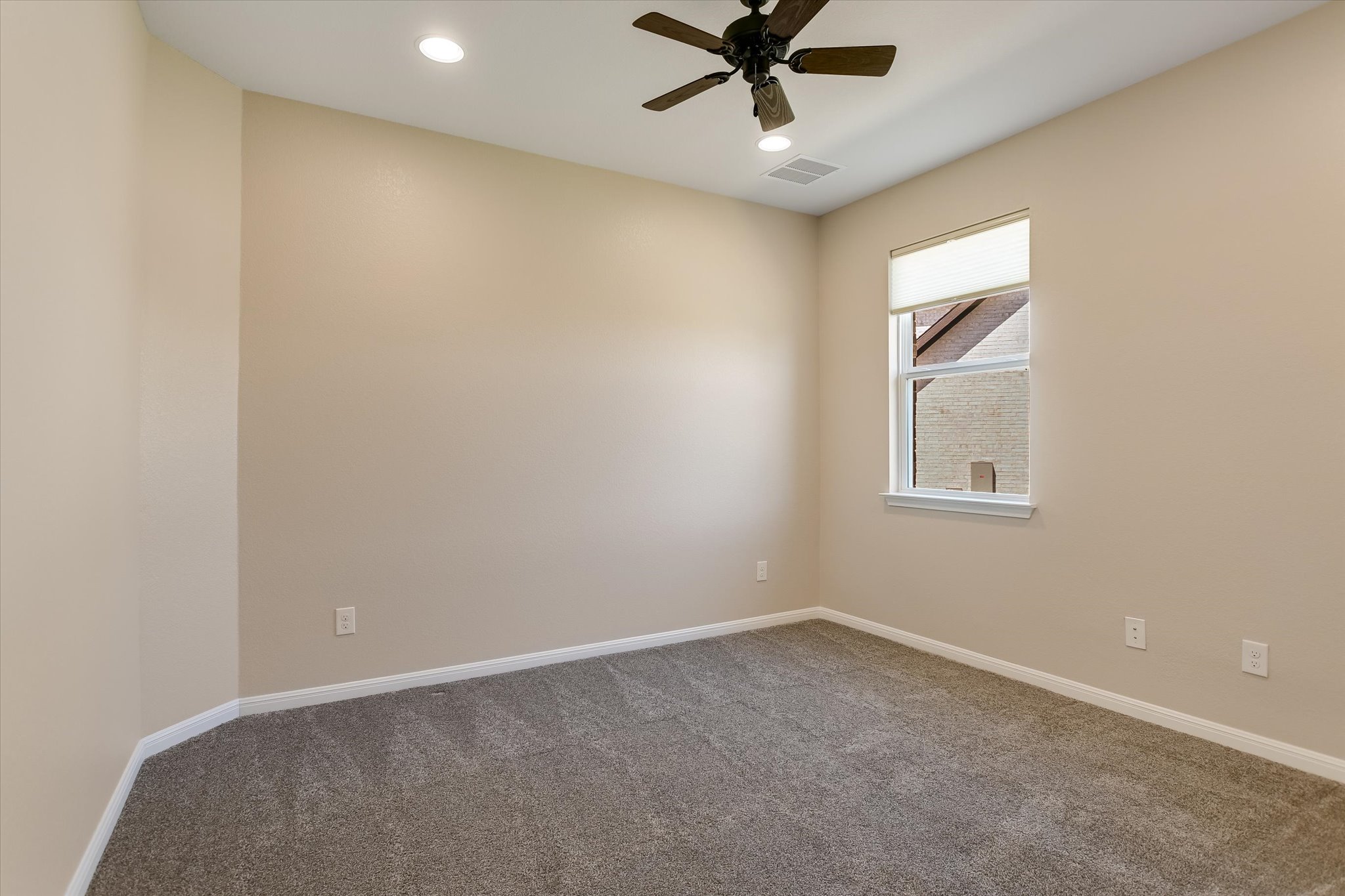 108 Trans Pecos Court Georgetown, TX 78628 - Photo 22 of 32 an empty room with a window and a fan