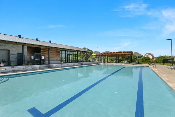 a view of swimming pool with a yard