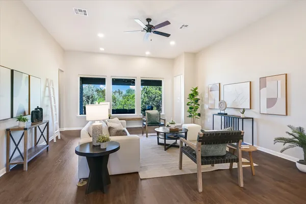 a living room with furniture and a large window