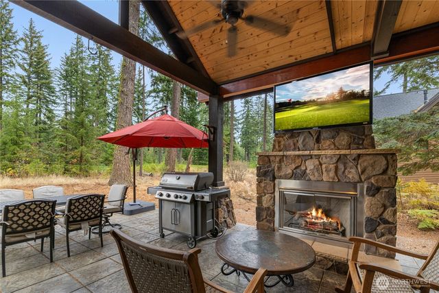 a patio with a table and chairs