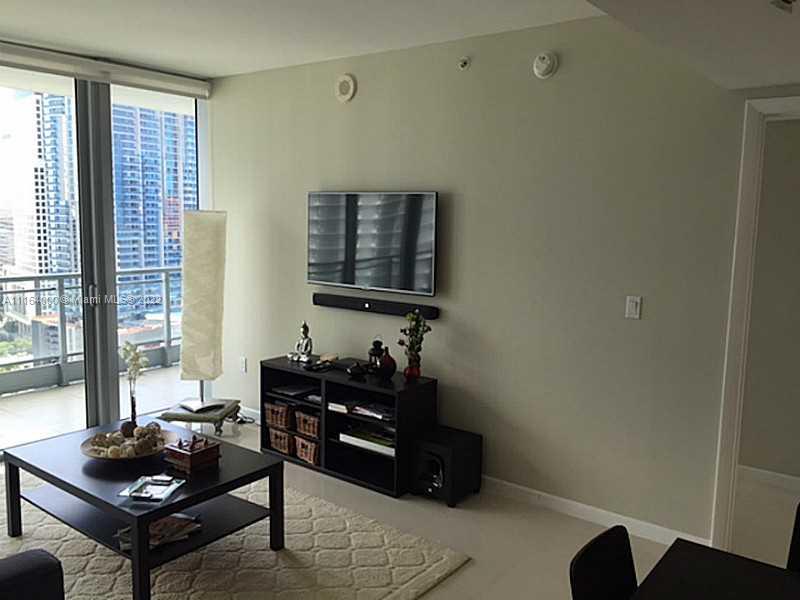 92 Southwest 3rd Street, Unit 2911 Miami, FL 33130 - Photo 4 of 16 a living room with furniture and a window