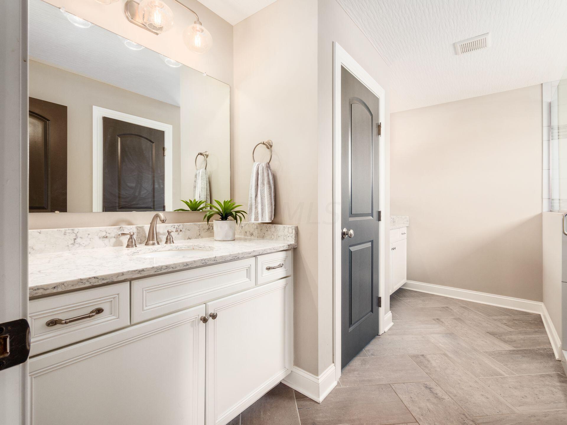 5408 Refugee Road Baltimore, OH 43105 - Photo 39 of 58 Separate Comfort Height Vanities w/ Granite Countertops & Linen Closet In Between.