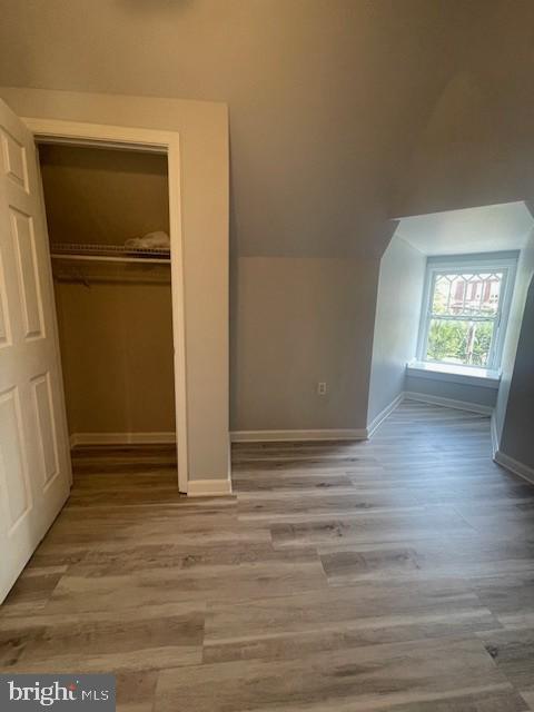 1122 Caroline Street, Unit 4 Fredericksburg, VA 22401 - Photo 12 of 15 an empty room with wooden floor and windows