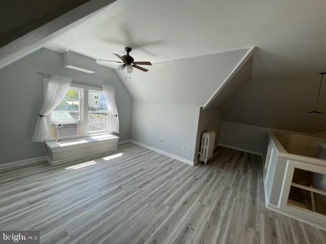 1122 Caroline Street, Unit 4 Fredericksburg, VA 22401 - Photo 4 of 15 wooden floor in an empty room with a window