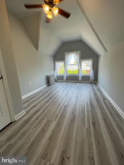 1122 Caroline Street, Unit 4 Fredericksburg, VA 22401 - Photo 6 of 15 wooden floor in an empty room with a window