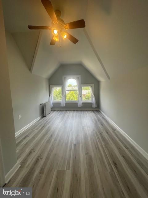 1122 Caroline Street, Unit 4 Fredericksburg, VA 22401 - Photo 7 of 15 wooden floor in an empty room with a window