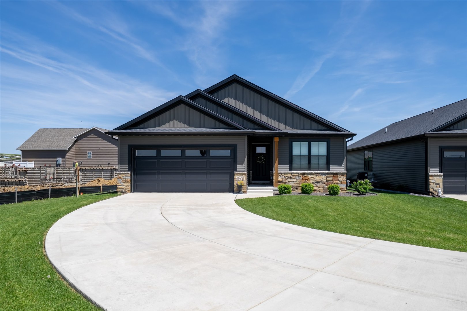 a front view of a house with a garden and porch