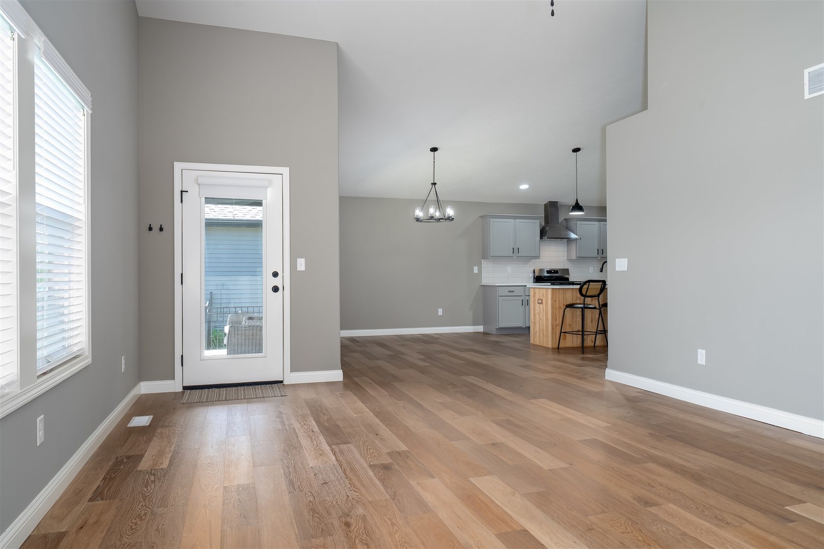 1172 Hershey Road Normal, IL 61761 - Photo 14 of 37 a view of empty room with wooden floor and windows