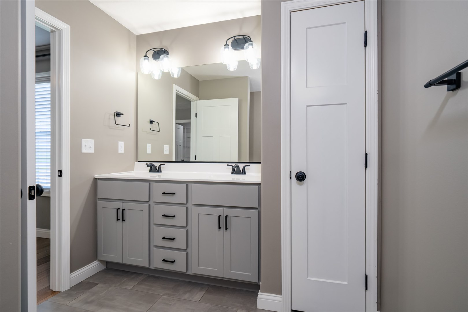 1172 Hershey Road Normal, IL 61761 - Photo 17 of 37 a bathroom with a double vanity sink and a mirror