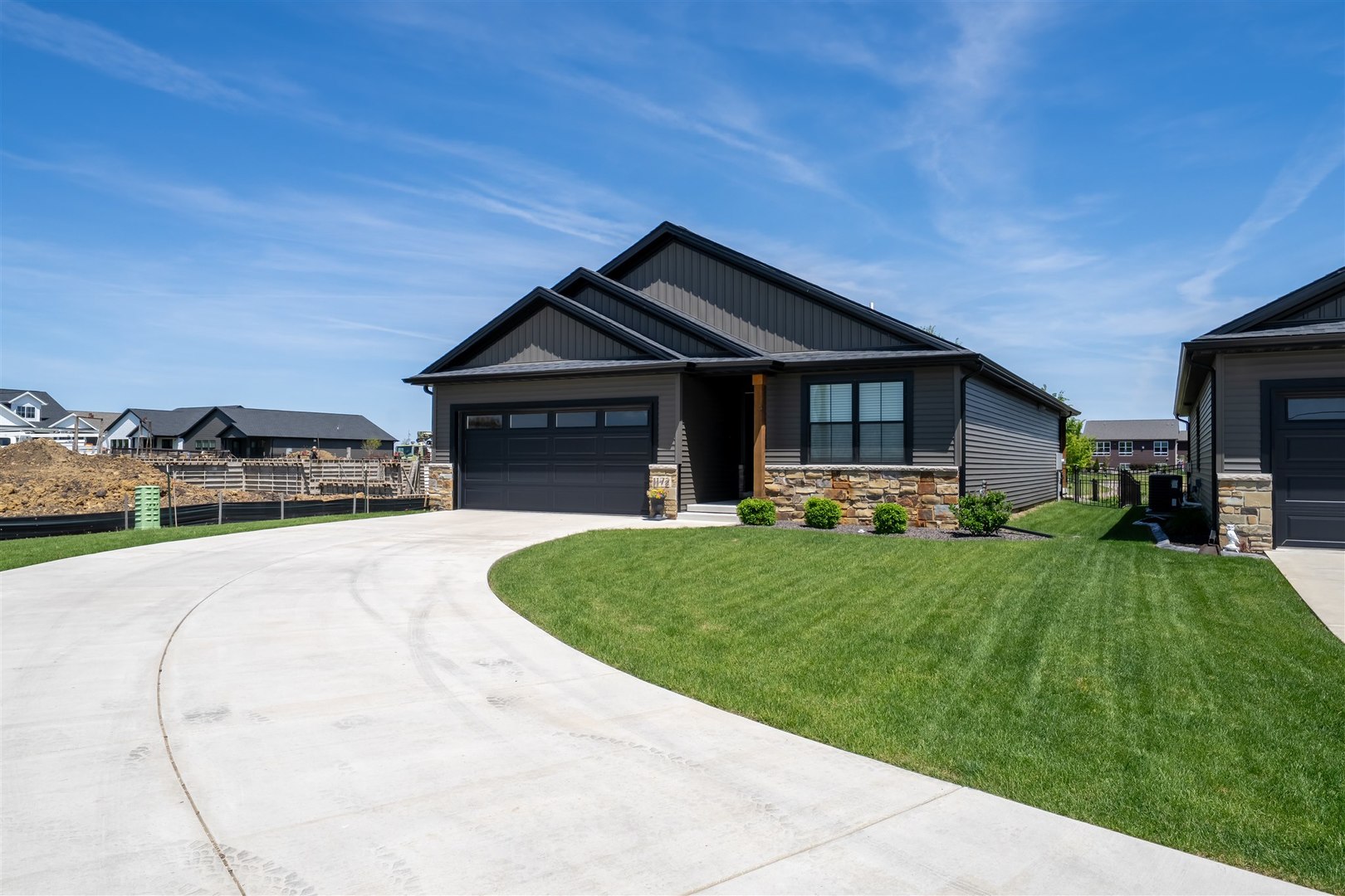 1172 Hershey Road Normal, IL 61761 - Photo 26 of 37 a front view of a house with a garden and patio