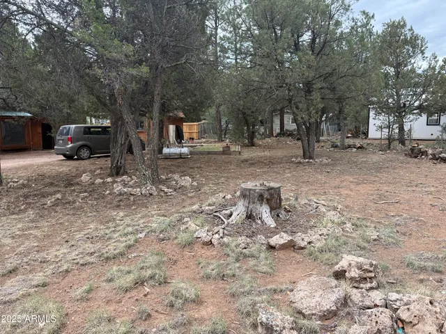 a backyard of a house with oven and outdoor seating