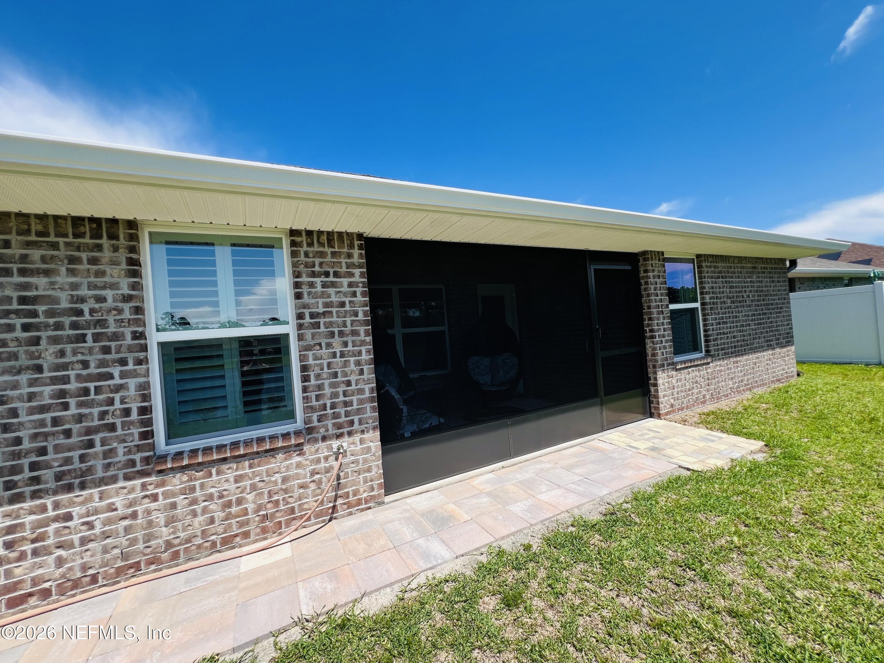 2 Rivertown Road Palm Coast, FL 32137 - Photo 9 of 80 a front view of a house with a yard and garage