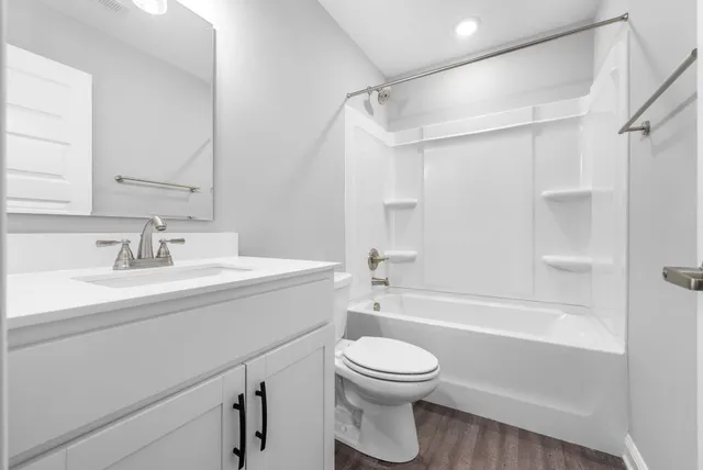 a bathroom with a sink a toilet and a bathtub