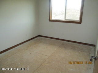 251 Hideaway Road Yakima, WA 98908 - Photo 14 of 17 a view of a small space with wooden floor and a window