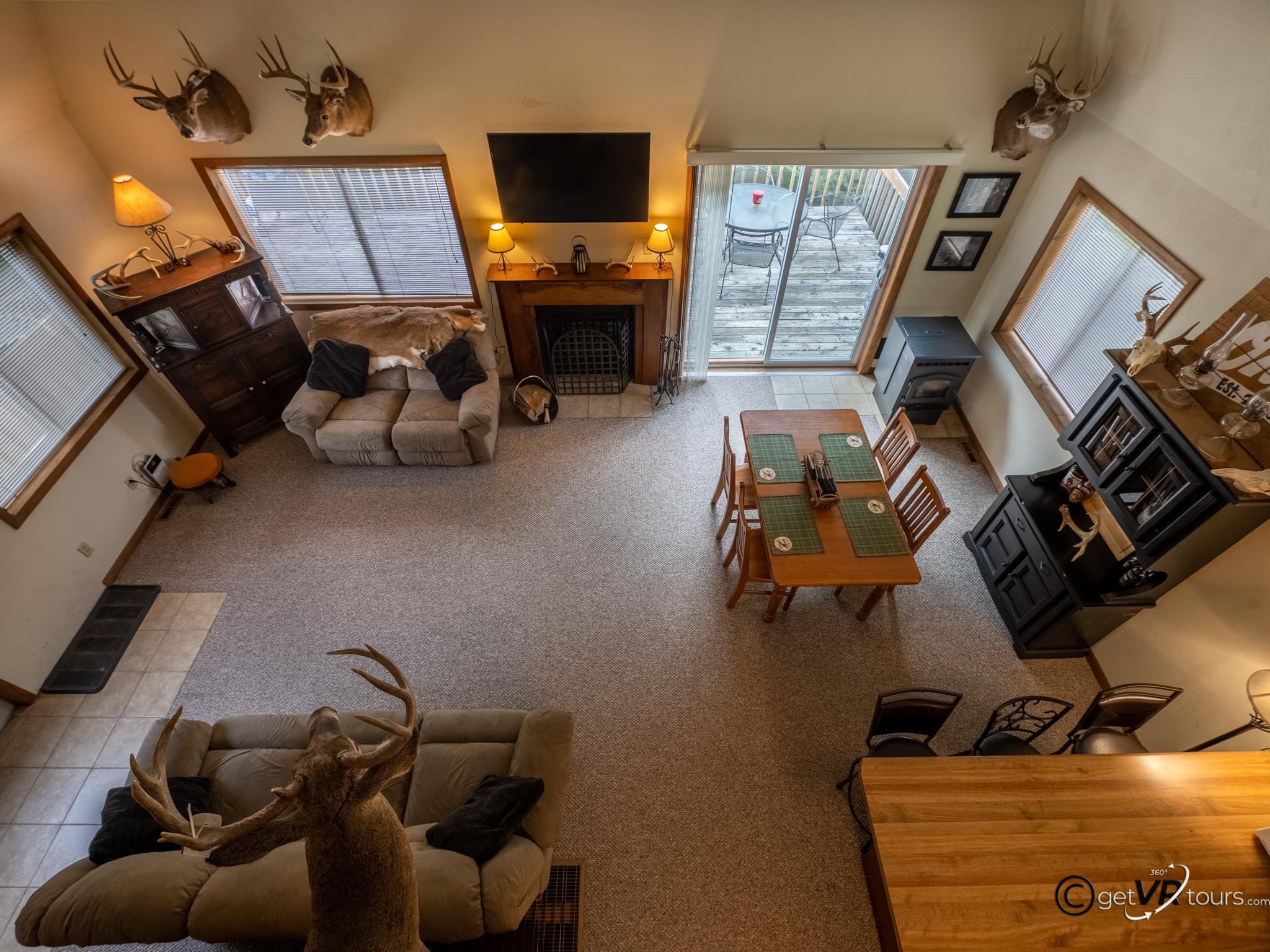 4561 East Welch Road Elizabeth, IL 61028 - Photo 16 of 60 a room with furniture and a flat screen tv
