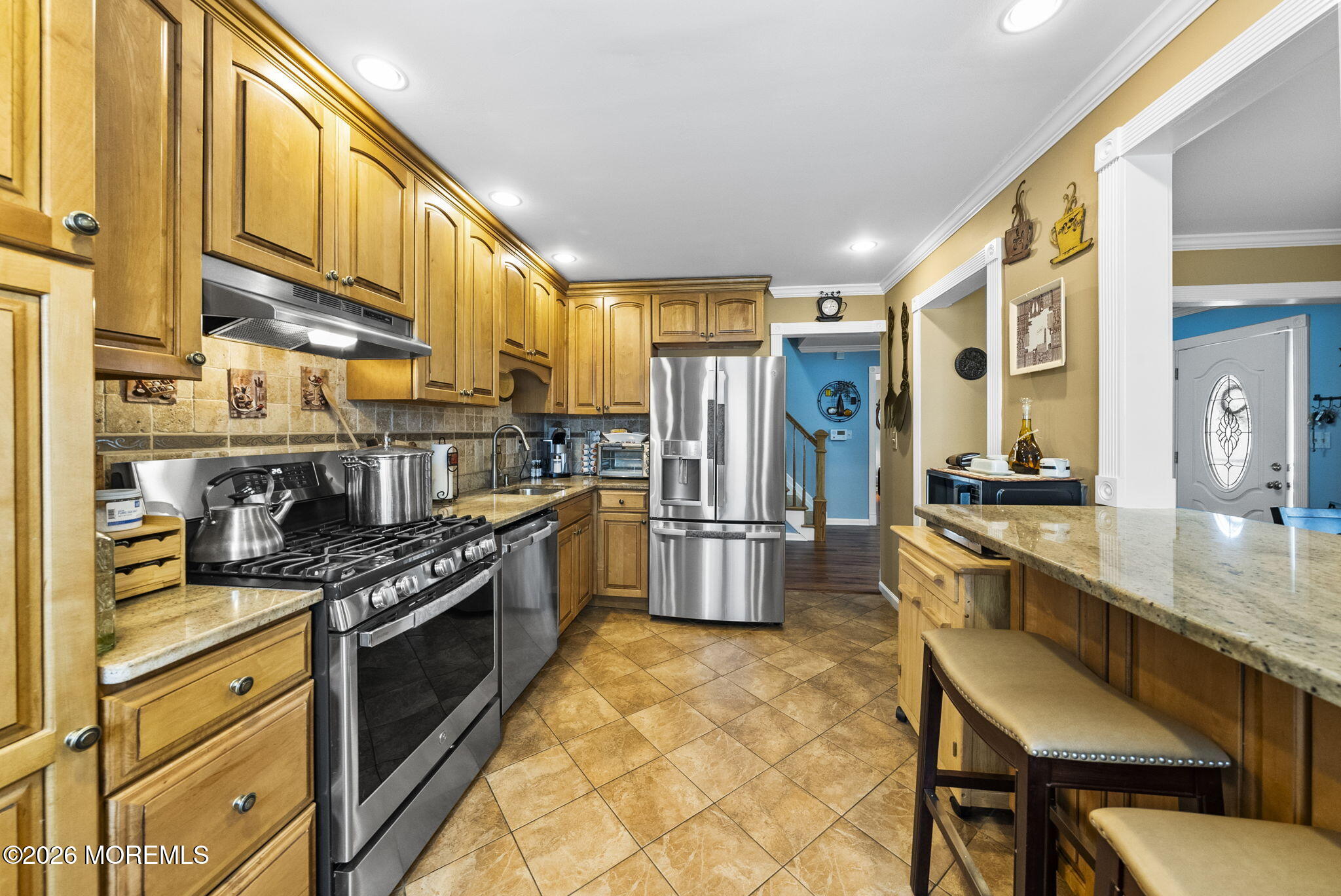 30 Arvin Road Old Bridge, NJ 08857 - Photo 12 of 31 a kitchen with stainless steel appliances granite countertop a sink a stove and a refrigerator