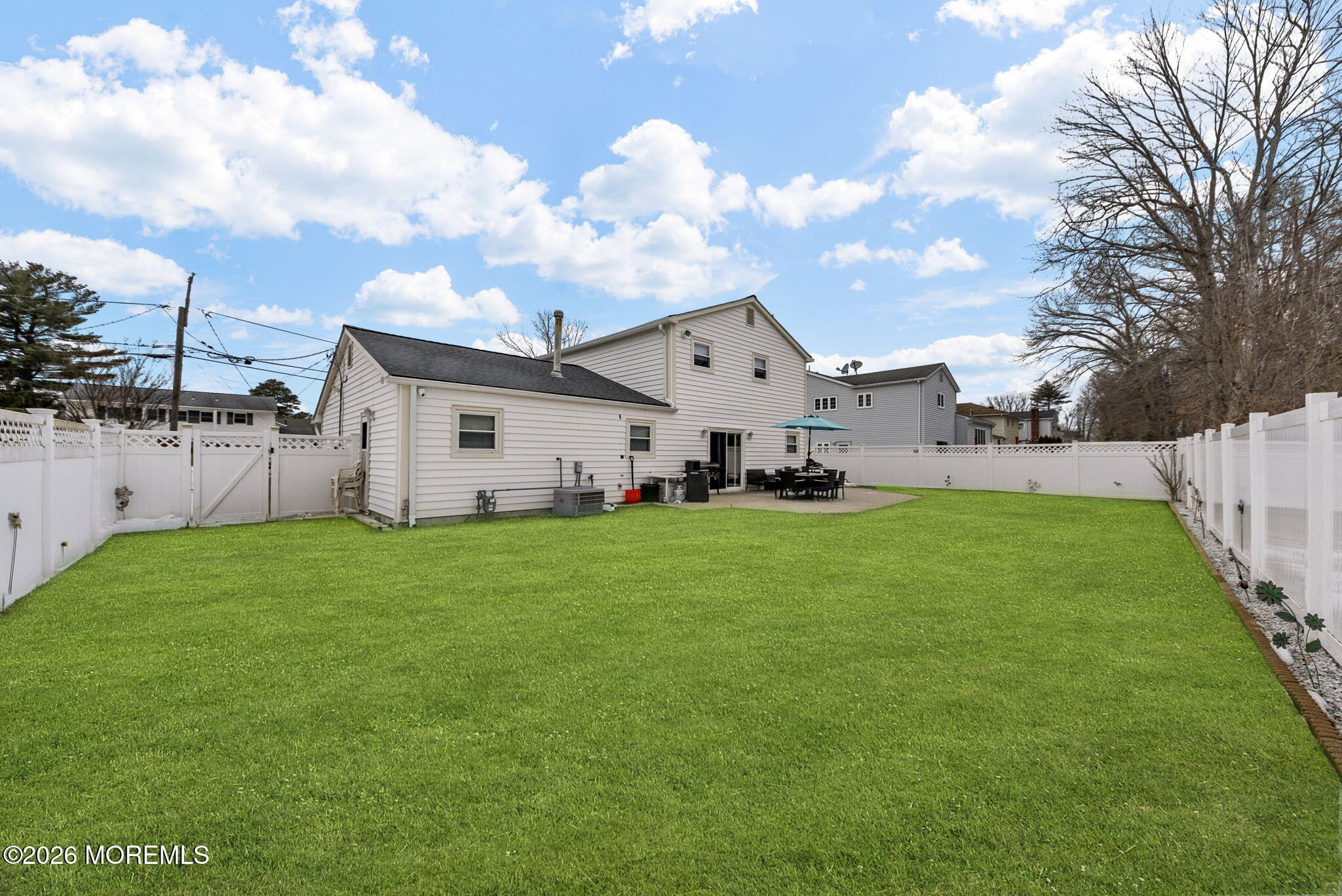 30 Arvin Road Old Bridge, NJ 08857 - Photo 28 of 31 a view of a white house that has a big yard