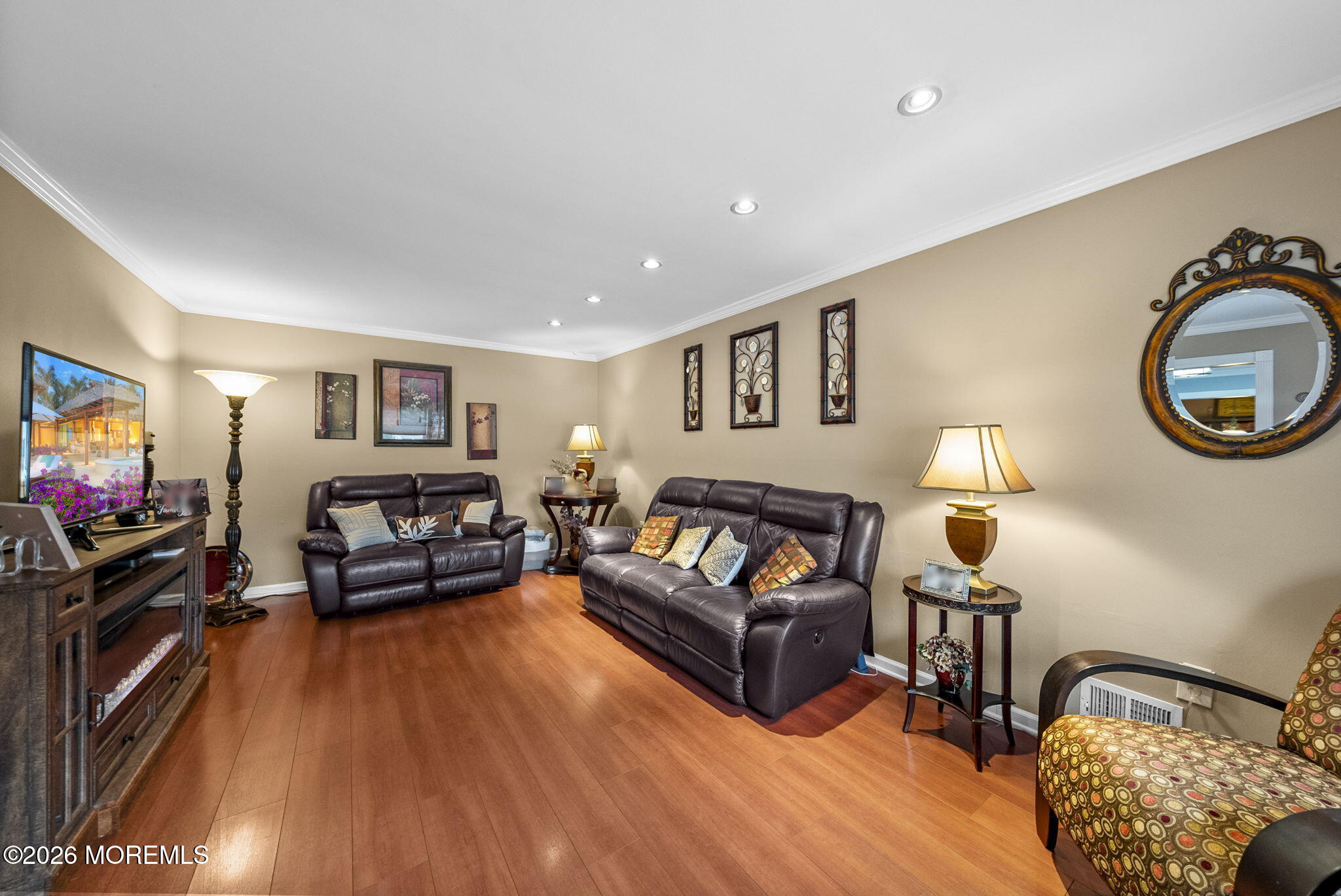 30 Arvin Road Old Bridge, NJ 08857 - Photo 5 of 31 a living room with furniture and a flat screen tv