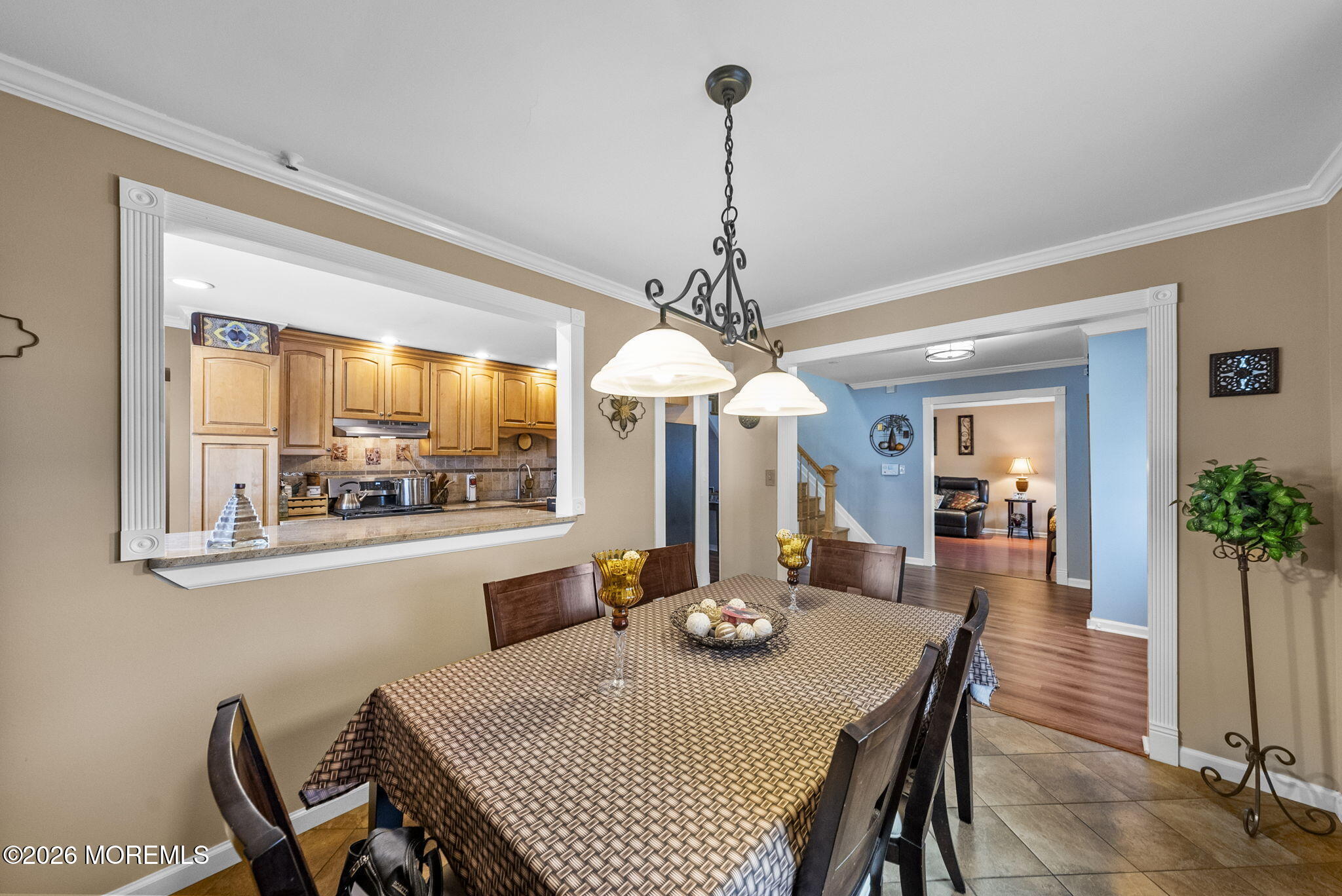 30 Arvin Road Old Bridge, NJ 08857 - Photo 10 of 31 a view of a dining room and livingroom with furniture wooden floor a chandelier