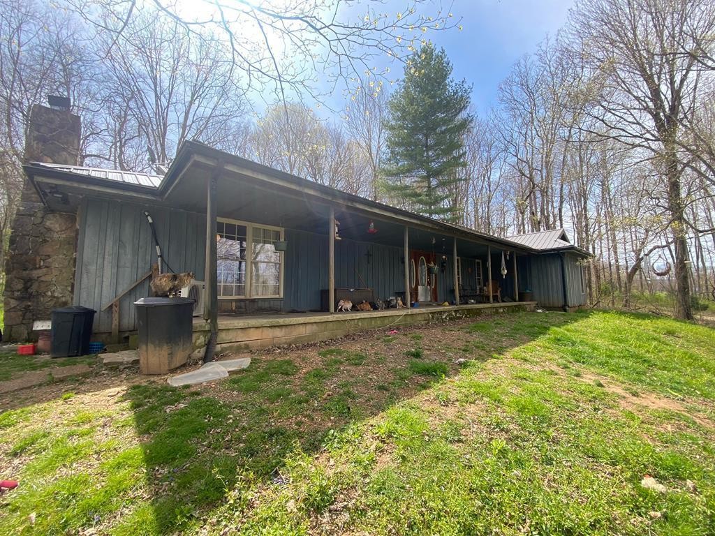 7080 Bolestown Road Alpine, TN 38543 - Photo 1 of 12 a front view of a house with garden