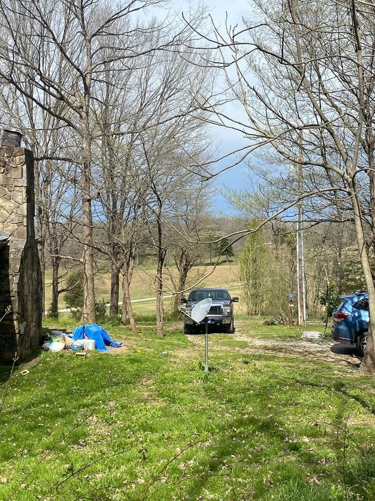 7080 Bolestown Road Alpine, TN 38543 - Photo 11 of 12 a car parked in front of the house
