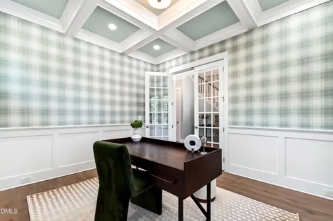 a living room with furniture a rug and a chandelier