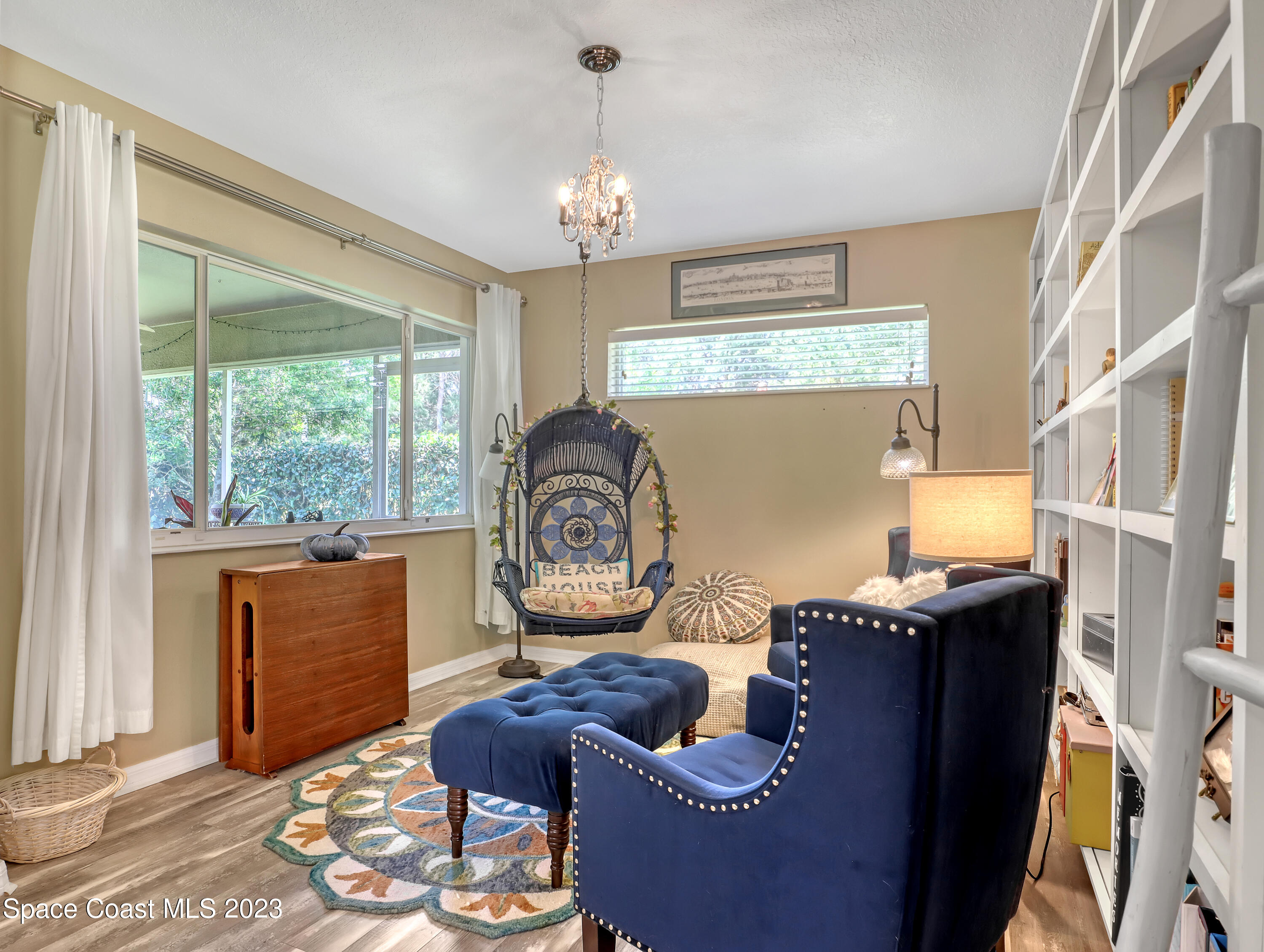 3625 Fodder Drive Rockledge, FL 32955 - Photo 22 of 47 a living room with furniture and a large window