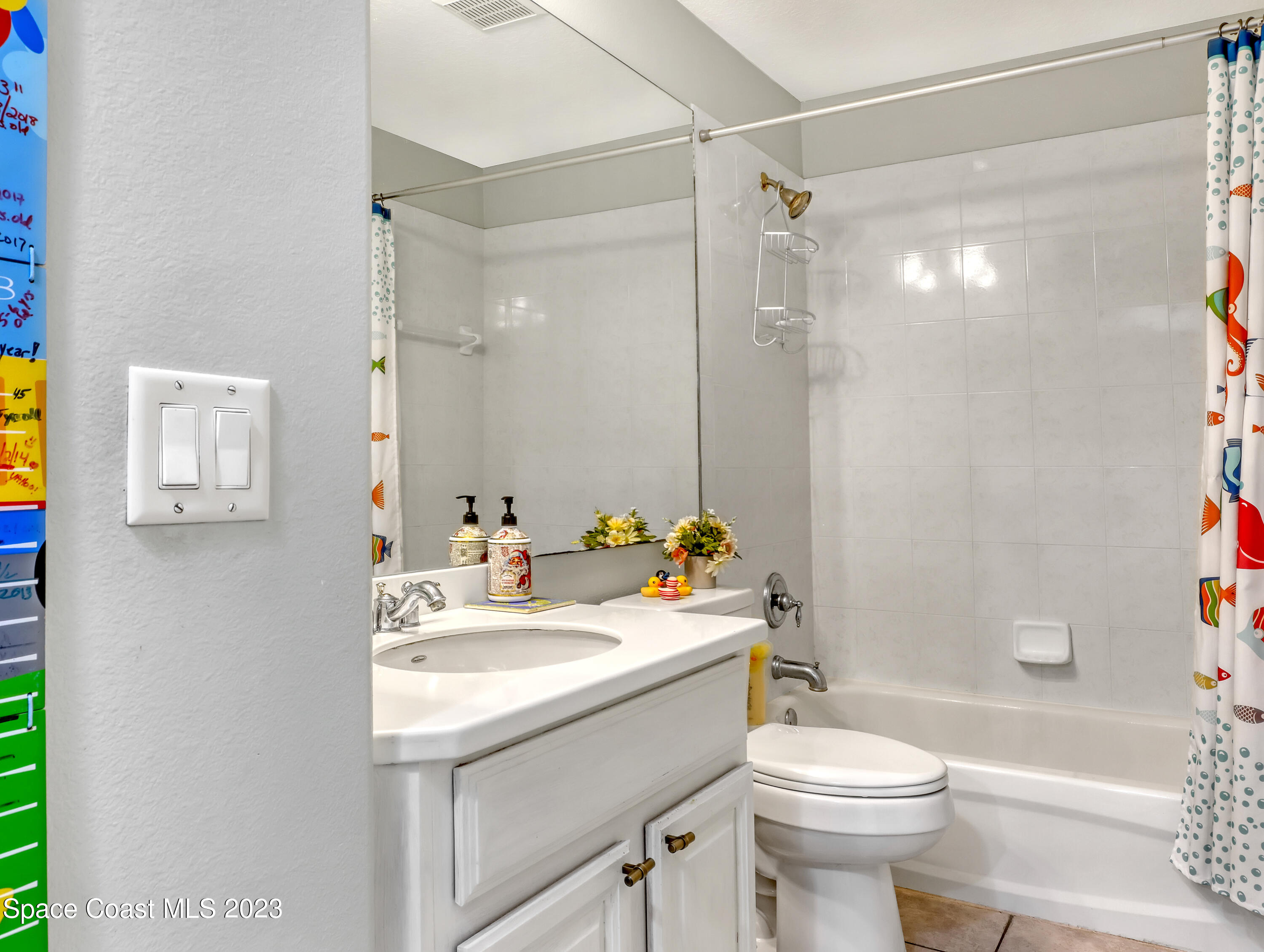 3625 Fodder Drive Rockledge, FL 32955 - Photo 30 of 47 a bathroom with a sink toilet vanity and shower