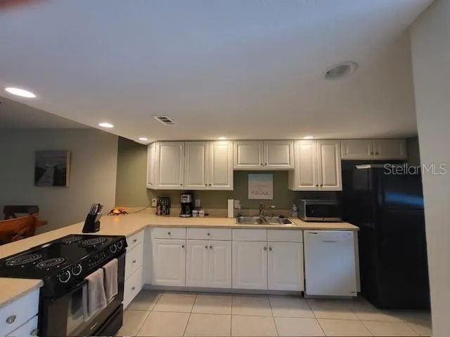a kitchen with a sink stove and refrigerator