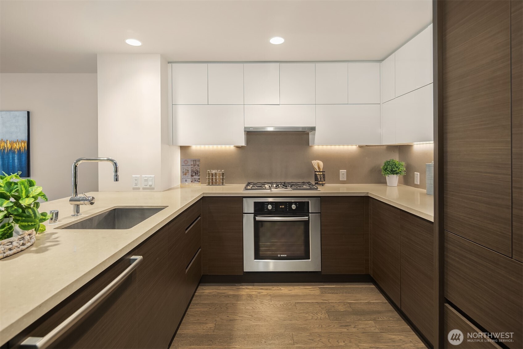 588 Bell Street, Unit 214S Seattle, WA 98121 - Photo 11 of 40 a kitchen with a sink and a stove top oven