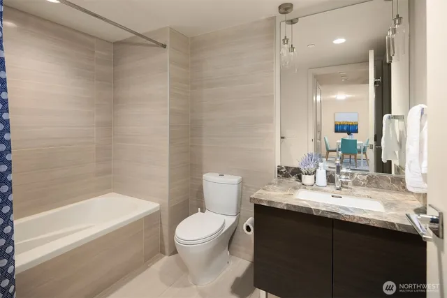 a work room with furniture and a rug