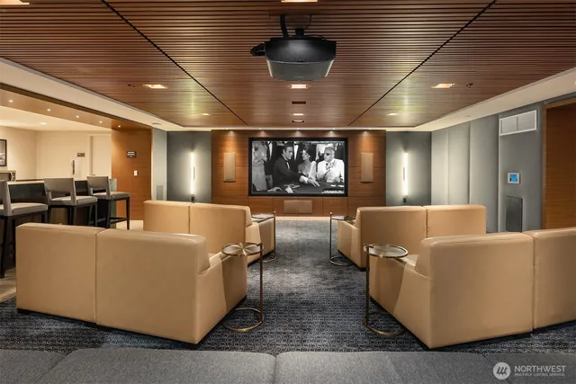 a view of a terrace with lawn chairs